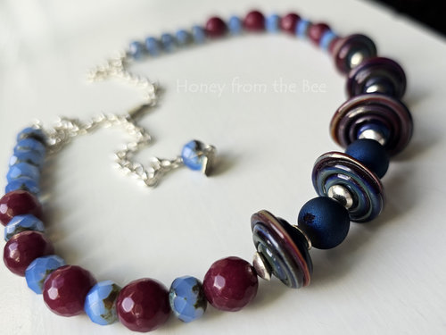 Lampwork necklace in blue and dark rose and sterling silver