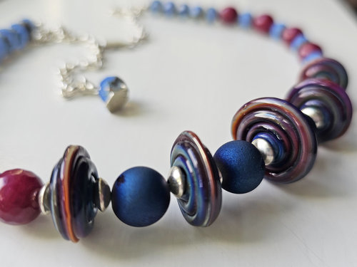 Blue and red necklace with disc lampwork and faceted gemstones
