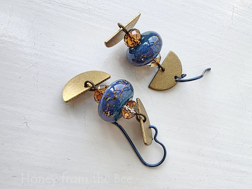 Blue lampwork earrings with brass accents