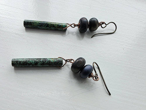 Artisan earrings feature turquoise tube dangles, gun metal lampwork and copper