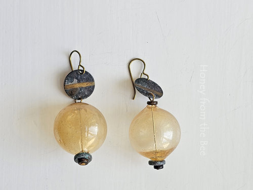 Boho earrings feature golden yellow lampwork and verdigris brass