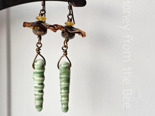 Yellow and green earrings in floral theme