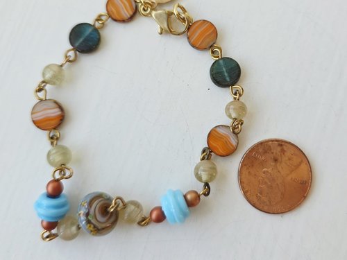 Beaded bracelet in blues and oranges