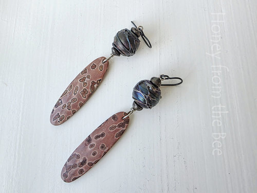 Artisan earrings feature lampwork and jasper in shades of pink and dark blue