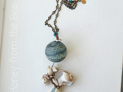 Aqua and white necklace for the beach features found shells