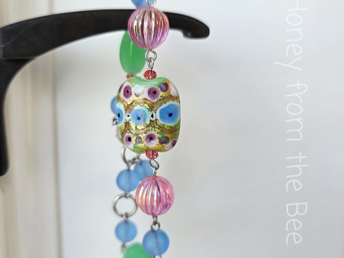 Colorful bead bracelet features lampwork bead with gold foil