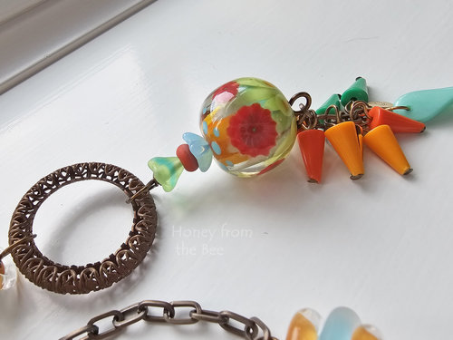 Exquisite lampwork focal in this bright and fun necklace
