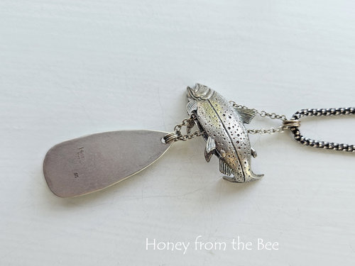 Photo shows back of sterling silver pendant