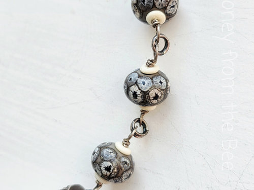 Black and white lampwork necklace with found white coral focal