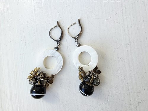 Party earrings feature antique buttons, mother of pearl and crystal
