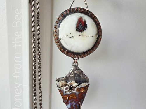 Statement necklace features plume agate and art glass