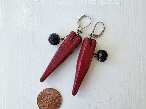 Heart earrings feature red wooden hearts and antique black button