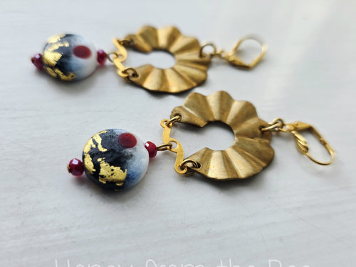 Artisan earrings in gold and red