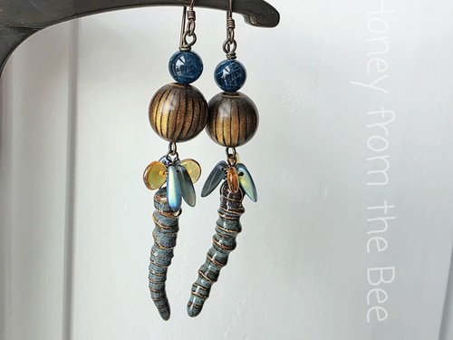 Long dangle earrings in brown and blue