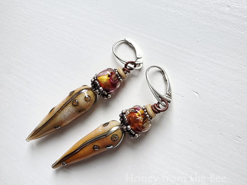 Artisan earrings feature lampwork and sterling silver