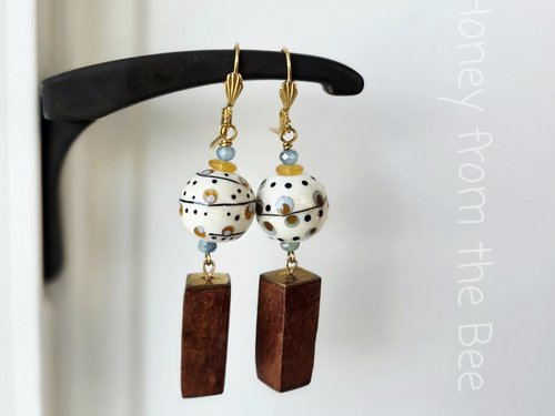 Artisan earrings feature lampwork and wood dangles