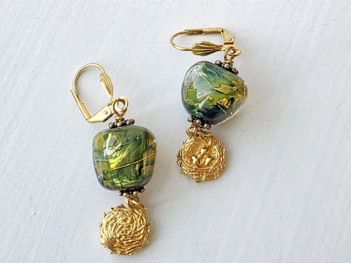 Lampwork earrings in green and gold with bird's nest dangle