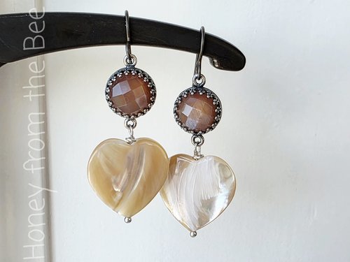 Rose earrings with cream hearts feature peach moonstone