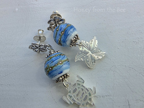 Sterling silver post earrings with blue and white lampwork