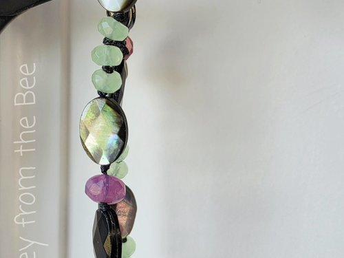 Faceted bead bracelet in grey, green, and pink
