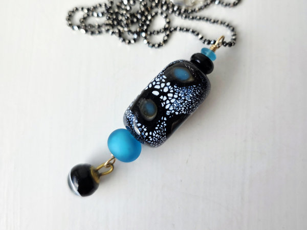 Blue and black lampwork pendant with antique button dangle