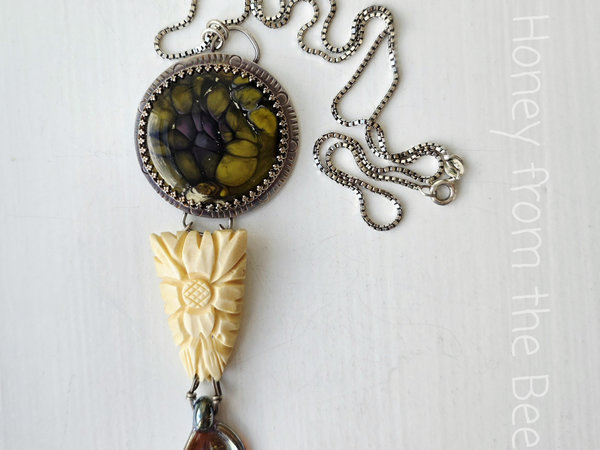 Garden necklace with flowers and butterfly wing