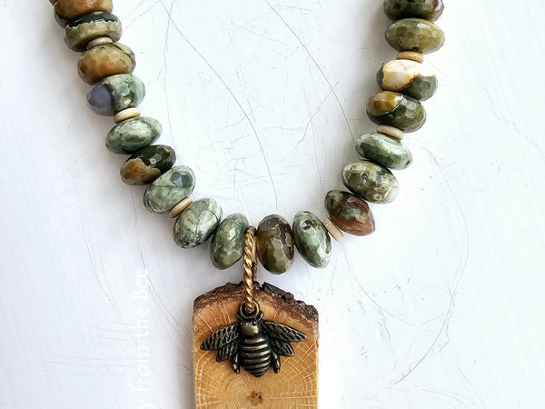Faceted green and brown gemstone necklace with wood and brass bee