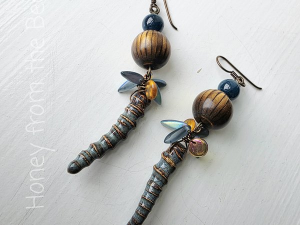 Artisan earrings in blue and brown